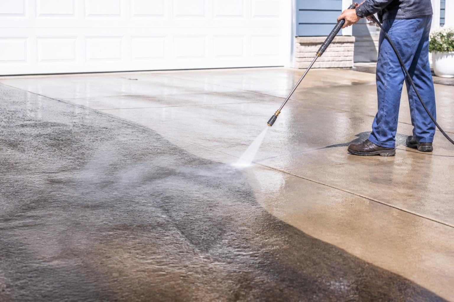 Pressure washing a driveway